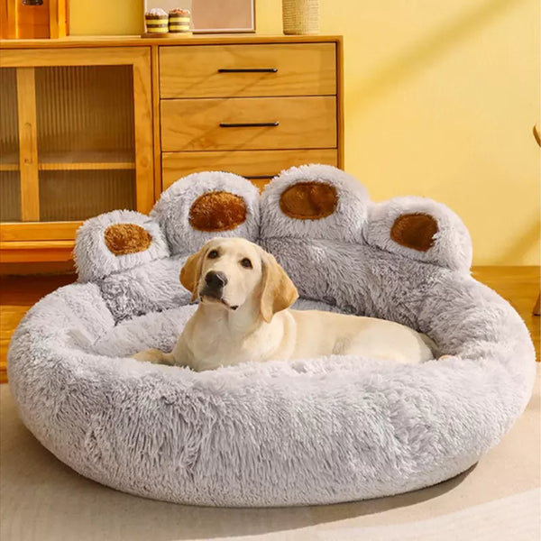 Giant paw snuggle pet bed - light grey fur dog sitting on bed